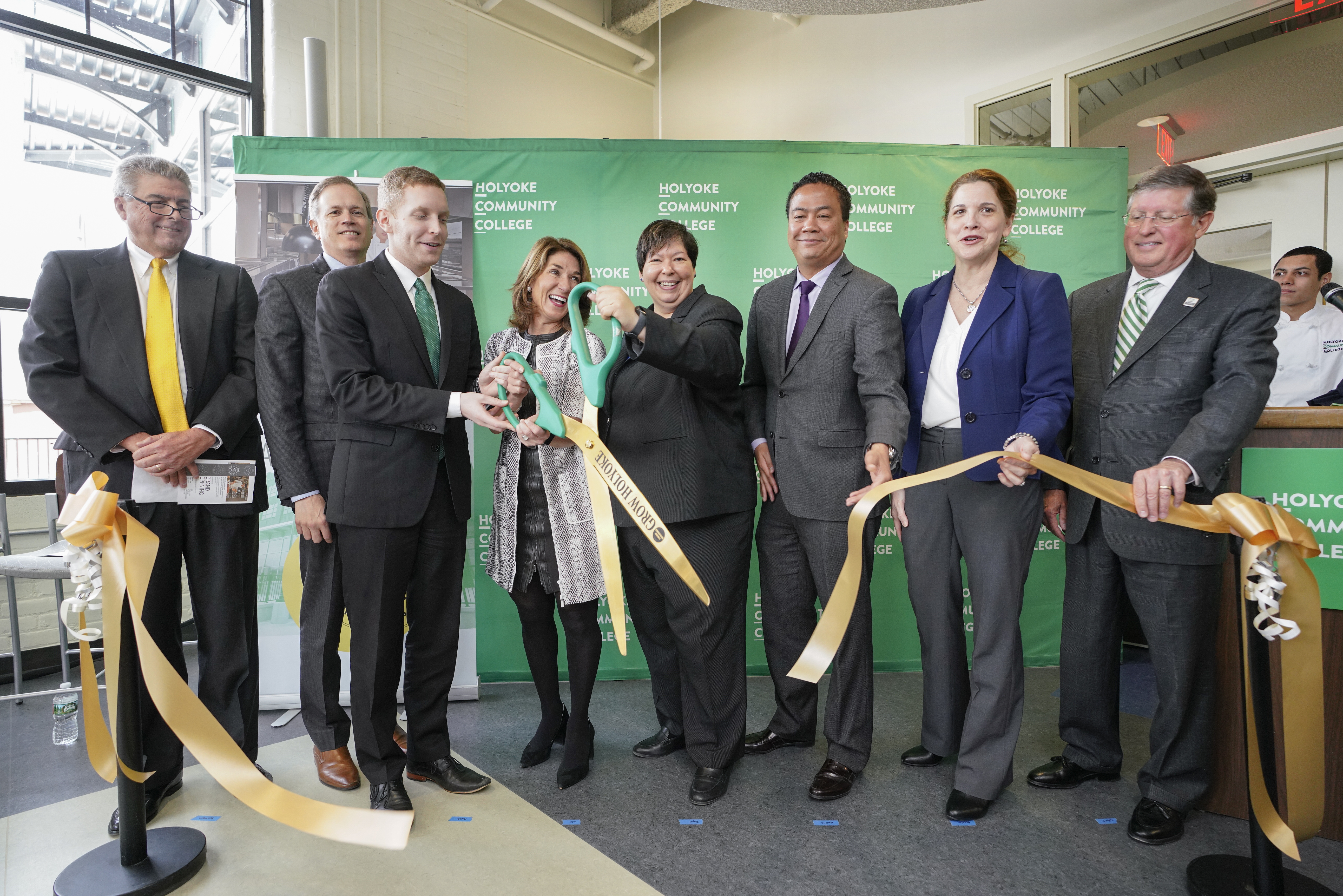 Christina Royal cuts a ribbon with a group of politicians